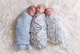 Hayley Arsenault's triplet boys, Hogan, Rylan and Finn are seen in this undated handout photo.