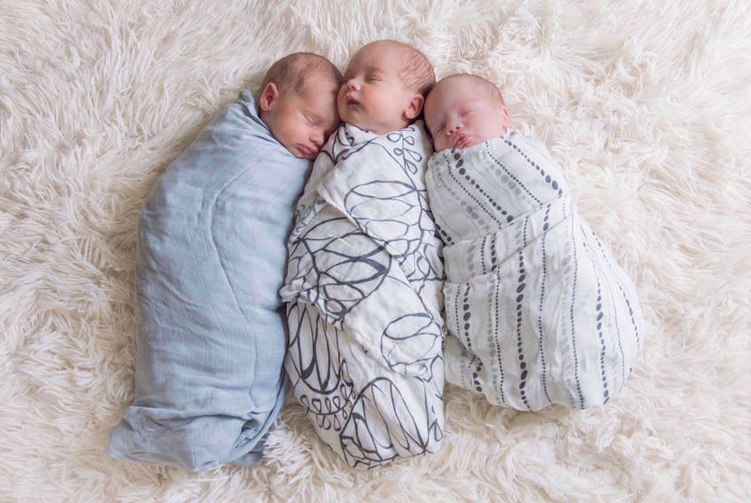 Hayley Arsenault's triplet boys, Hogan, Rylan and Finn are seen in this undated handout photo.