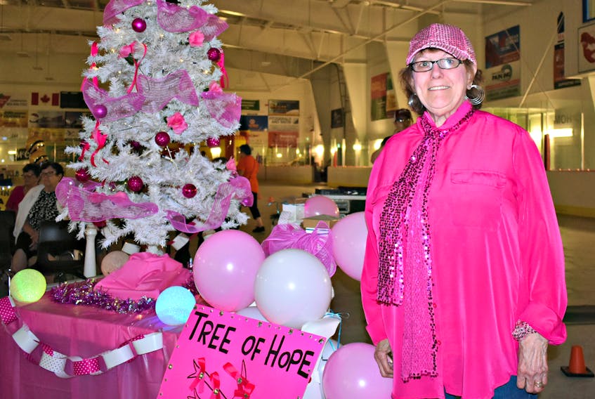 Paula Gallant stands in front of her pink breast cancer tree that represents hope at the Evangeline Mini-Relay held in the Evangeline Recreation Centre, Saturday.