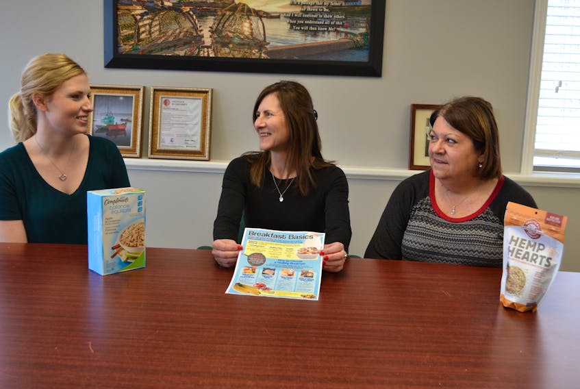 Cheryl DesRoches, center, coordinator of Tignish Fisheries/Royal Star Foods’ Wellness Plan, discusses easy and nutritious breakfast choices with fellow office workers Lisa Inman, left, and Angela Gaudet. The fish plant has held healthy breakfast demonstrations and is getting ready to host other special events to promote wellness.