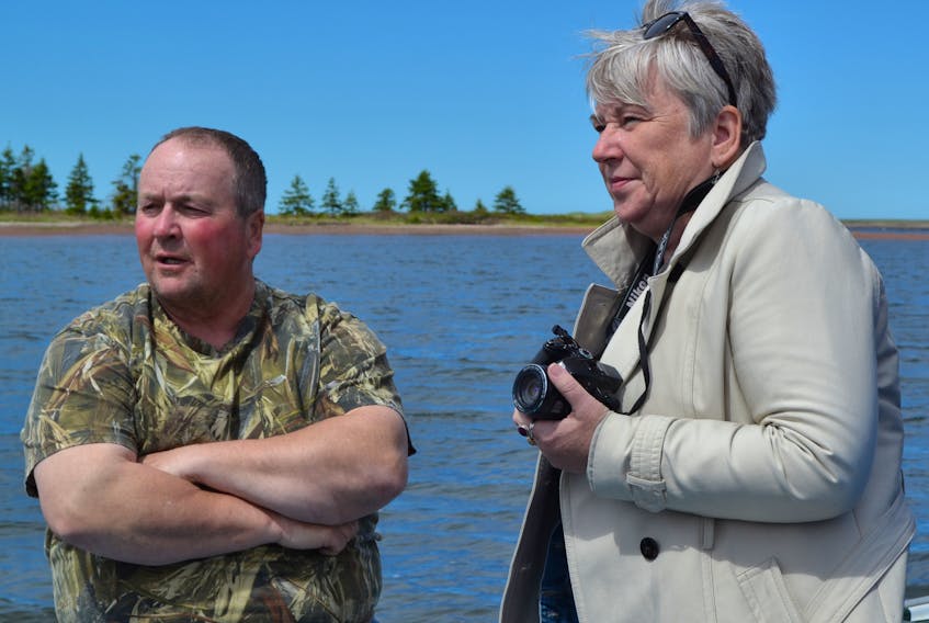 Milligan’s Wharf fisherman Lloyd Phillips discusses fishery issues with Bernadette Jordan, chairwoman of the House of Commons standing committee on fisheries and oceans, during a sail out of Hardy Channel last week.