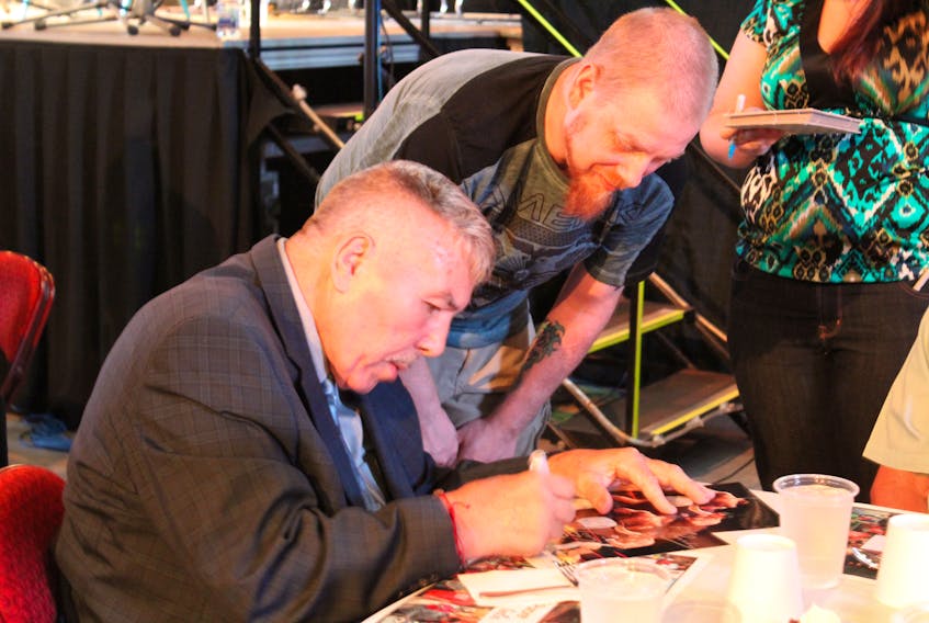 Hundreds of people attended the annual Summerside Boys and Girls Club Atlantic Superstore Celebrity Dinner Gala Monday evening. Rickey Miller, right, took the opportunity to get an autograph from legendary Canadian boxer, George Chuvalo.