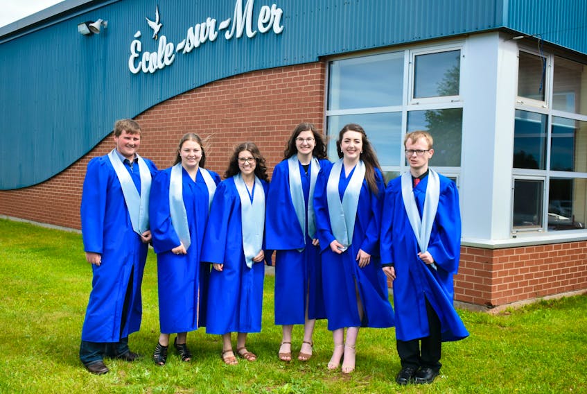 Jaden Johnston, from the left, Madison Orton, Chloe Gallant, Katelyn Singer, and Callum Matthews are the first-ever graduates at École-sur-Mer in Summerside on Saturday evening.