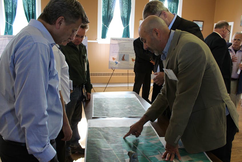 Ken Sampson, right, explains part of a proposed Maritime Electric project during a meeting Thursday night.