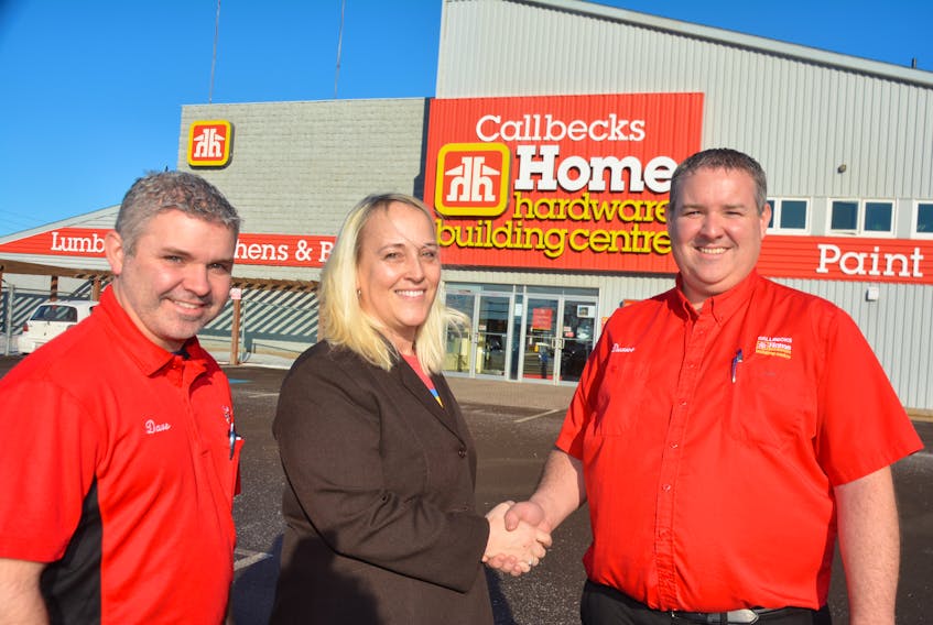 Dave and Duane MacDonald, left and right, co-owners of Callbecks Home Hardware and Summerside Home Furniture, with Lori Ellis, of Culture Summerside. Callbecks has signed up to be the title sponsor of this year’s Summerside Lobster Carnival Parade.