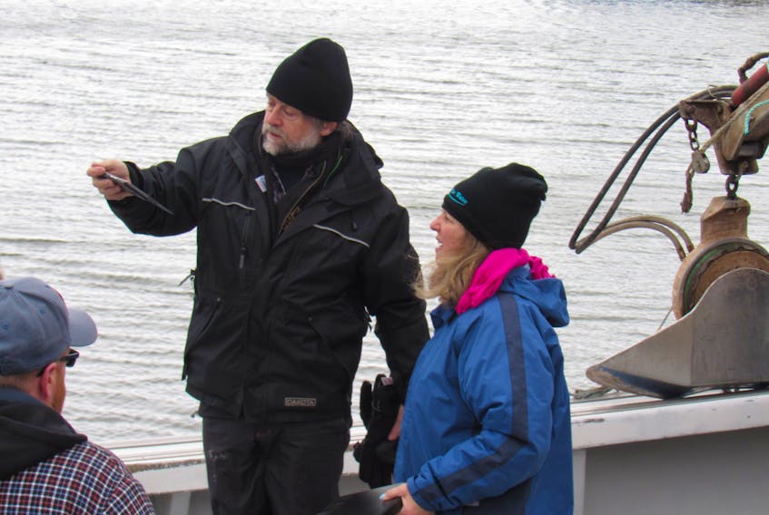 SUBMITTED PHOTOS BY EDITH COLE
Cinematographer Christopher Ball and Island filmmaker Susan Rodgers discuss a shot during a recent shoot at Malpeque Bay.
