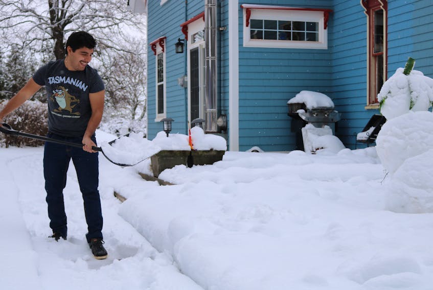 Ramón Velasco Alfonzo gets an authentic Canadian experience: shovelling snow.