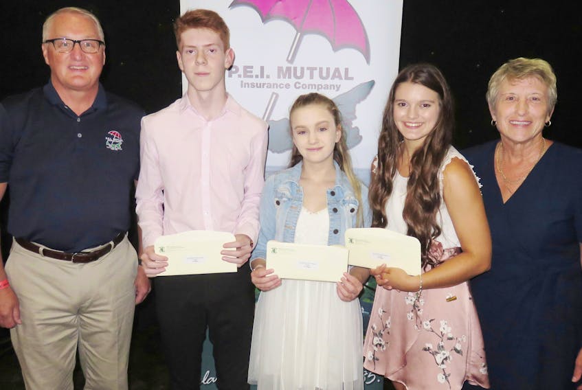 Brennen Gallant of New Glasgow, second left, is the 2018 Provincial P.E.I. Youth Talent Search Champion. Gallant took top honours at the provincial competition with his fingerstyle guitar instrumental solo and received $750 from P.E.I. Mutual Insurance Company representative Blair Campbell, left. In second place and receiving $350 is Krysten Cameron of Summerside, centre, with third place and $150 going to Joselyn Jelley of Howlan. Congratulating the winners is Provincial Youth Talent co-ordinator Jean Tingley. The event was hosted by L'Exposition agricole et le Festival acadien in Abram-Village.