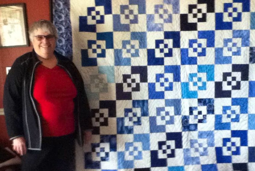 Sharon Long, president of the Green’s Shore Quilters, displays the handmade quilt that will be on raffle for the Green’s Shore Quilters Quilt Show to be held at St. Eleanors Community Centre, Summerside, on April 21 from 10 a.m. to 7 p.m. and April 22 from 10 a.m. to 4 p.m.