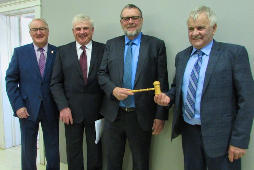 The new executive of P.E.I. Mutual Insurance Co. was recently elected following the company’s 2018 Annual General Meeting. Incoming President Claude Dorgan (second right) accepts the gavel from outgoing President Brian MacKinley. Also on hand are vice-president Jim Doyle (second left) and Blair Campbell (left) the company’s new CEO.