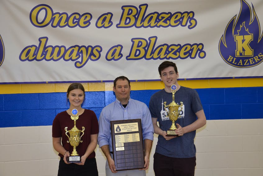 Athletic director Trent Ranahan, centre, congratulates Kinkora Regional High School’s 2018-19 athletes of the year, Maddy Moffatt and Robert Greenan. The presentations were made during the Blazer Awards Blitz in the school’s gymnasium on Thursday.