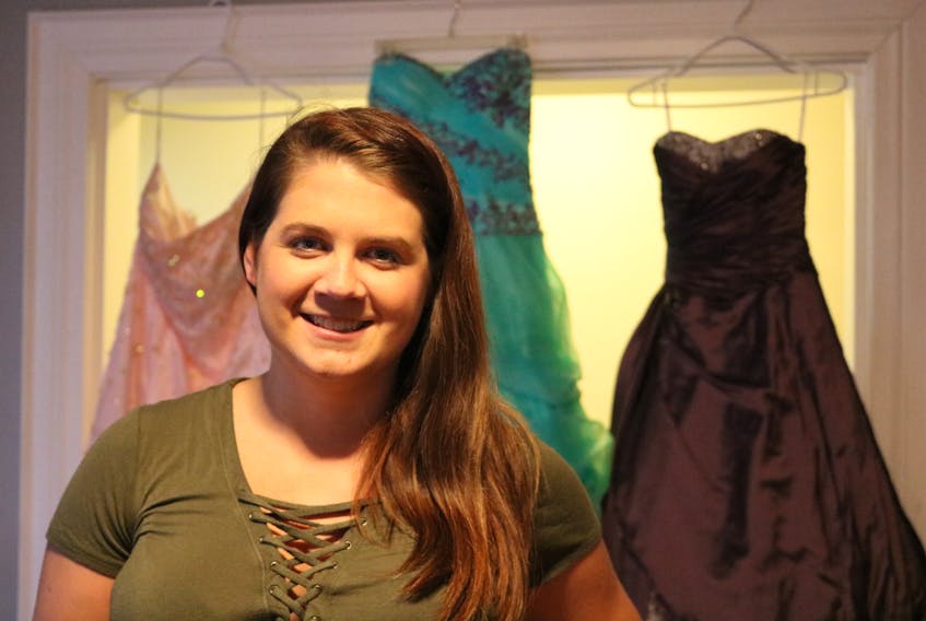 Sarah Gillis airs out some of the prom dress donations she has received since starting Prom Project P.E.I. The group is designed to collect prom dress donations and provide other services to high school students to help alleviate financial stress.