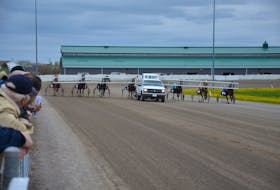 The starting gate approaches the start during a recent harness racing card at Red Shores at Summerside Raceway.