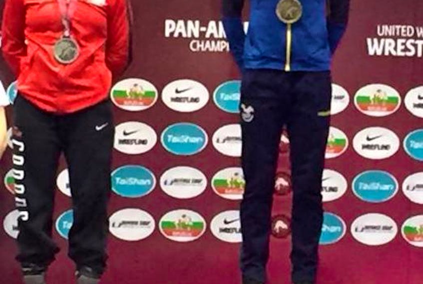 Silver-medallist Hannah Taylor, left, and gold-medallist Lissette Antes Castillo of Ecuador on the podium at the recent Pan American senior wrestling championships in Buenos Aires, Argentina.