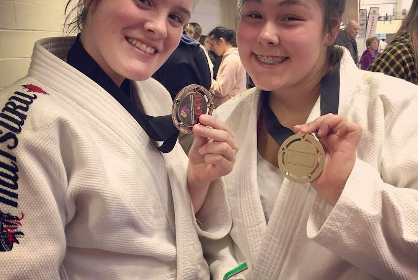 Alicia Thomas, right, with fellow Lennox Island Judo Club member, Loren Enman, displaying their medals form a recent Eastern Canadian judo competition. Thomas is competing in the Elite national championships in Montreal, Que., this weekend.