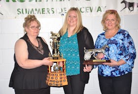 Lynn Whitlock, left, and Brenda MacInnis, right, of the Prince County Horsemen’s Club (PCHC) present Melissa Rennie with the award for 2018 horsewoman of the year. The PCHC held its annual awards dinner at Credit Union Place in Summerside recently.