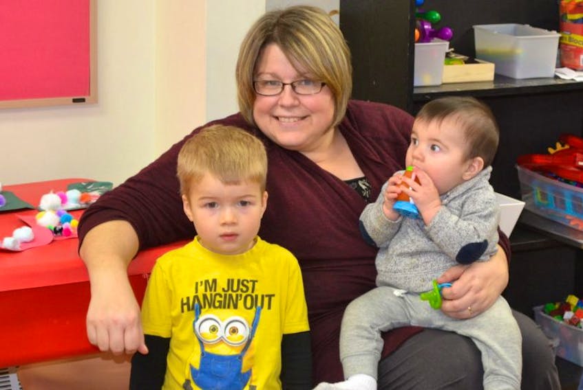 Brayden Cooke hangs out with Reid MacKenzie and Infant Care Centre staff member Krista Gallant during official opening celebrations for CHANCES’ O’Leary Centre on Monday.