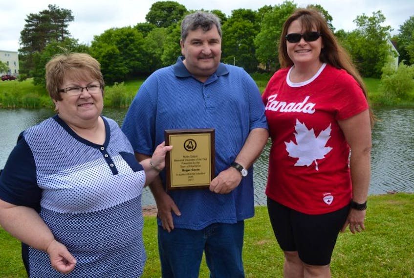 Norma Getson, left, and Alberton Town Councillor Kelly Williams present Roger Gavin with the Town of Alberton Myles Getson Volunteer of the Year Award.