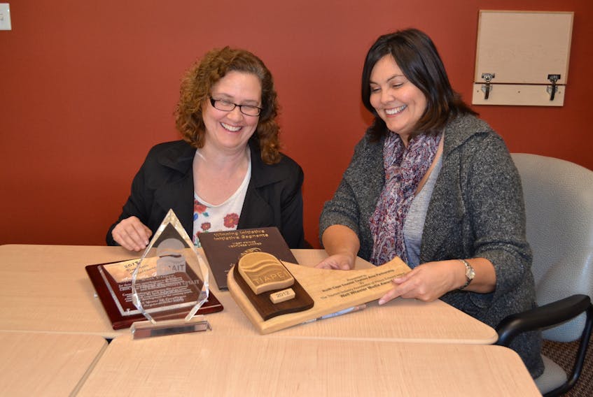 Carol Rybinski, left, West Prince Chamber of Commerce secretary and awards committee member and Tammy Rix, the Chamber’s executive director, examine award plaques for design ideas for their 2017 Business Excellence Awards Gala. Five awards will be presented during the Feb. 22 gala dinner.