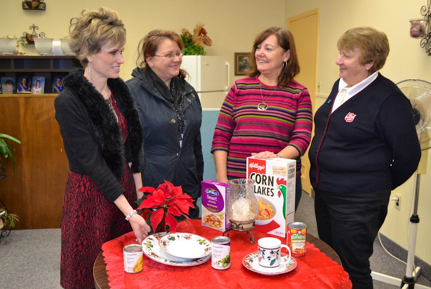 Corina Bolo, second right, West Prince Christmas Hampers Group coordinator, chats with representatives of groups that provide hampers, from left, Kara Katmouz, West Prince Family Violence Prevention; Teresa Marleau, Palmer Road Parish and Greta Owens, Summerside Salvation Army.