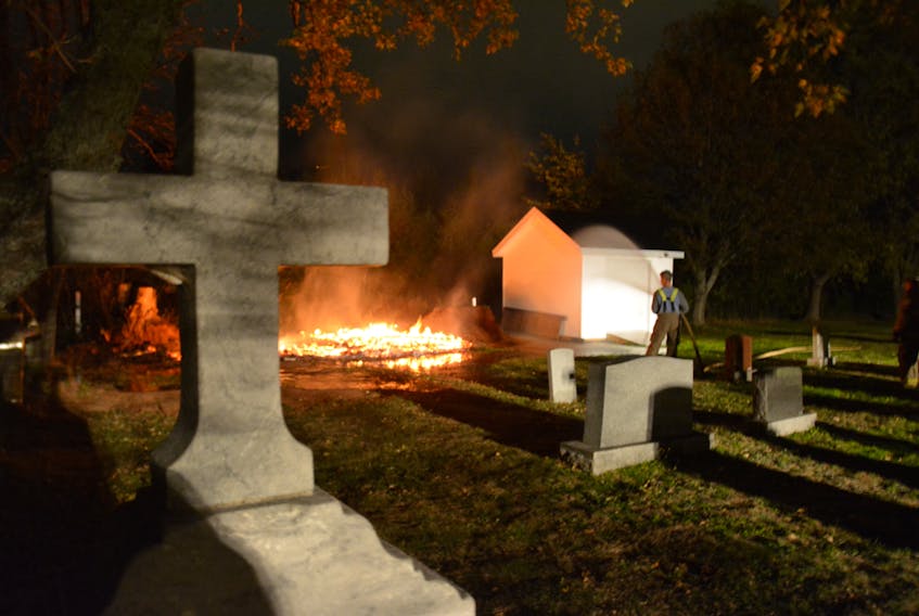 Summerside firefighters used a controlled burn to destroy an old shed at St. John's Anglican Church's graveyard Monday night.