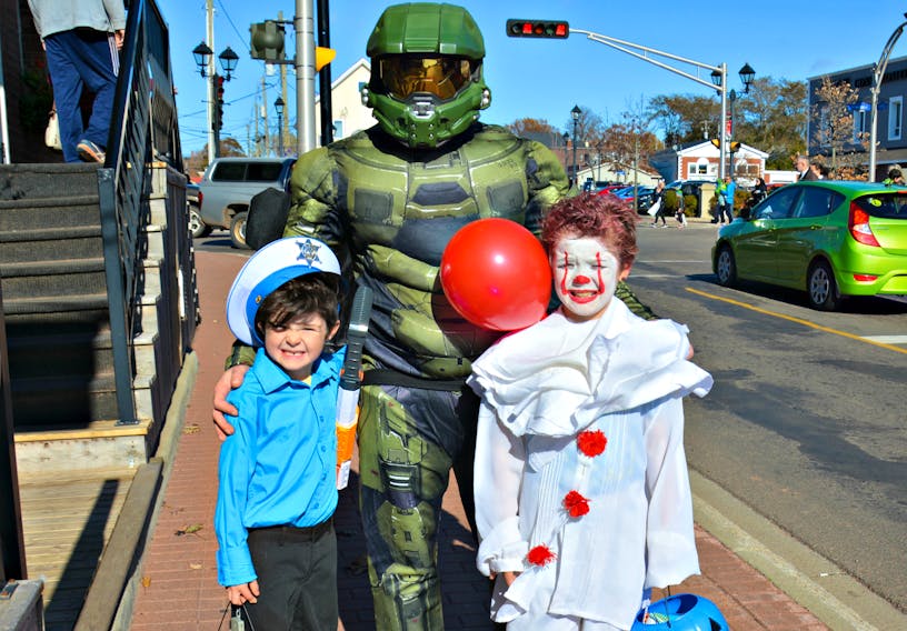 Mathew Gaudet dressed as Master Chief from Halo, with his sons’ Jaxen, who is dressed as a sheriff, and Max as Pennywise the Dancing Clown.