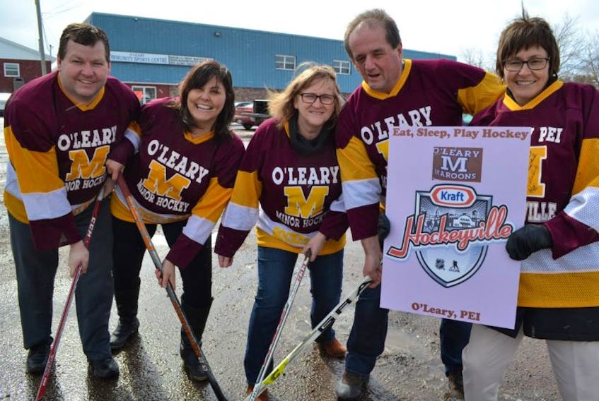 The O’Leary Hockeyville committee, from left, Dean Getson, Tammy Rix, Jo-Anne Wallace, Bill MacKendrick, Della Sweet and, missing, David Peters, are preparing for a Saturday night party where they hope to learn their Community Sports Centre makes it through to Hockeyville’s final round.