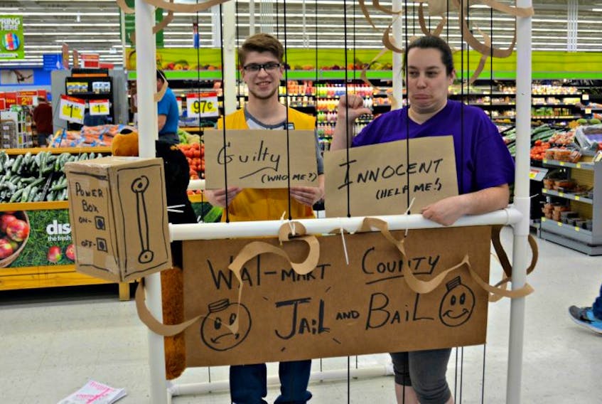 Jacob Campbell (left) and Colleen Verret go behind bars in Summerside Walmart all for a great cause.