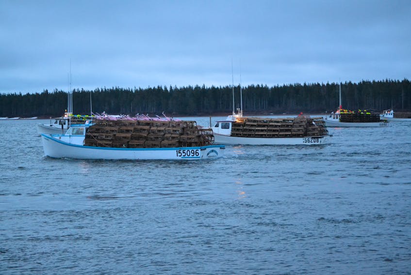Lobster boats sail out of Alberton Harbour on setting Day, April 29. Next year, if a measure fishermen voted in favour of is approved, they will see the minimum carapace size of their lobsters increased by a millimeter.