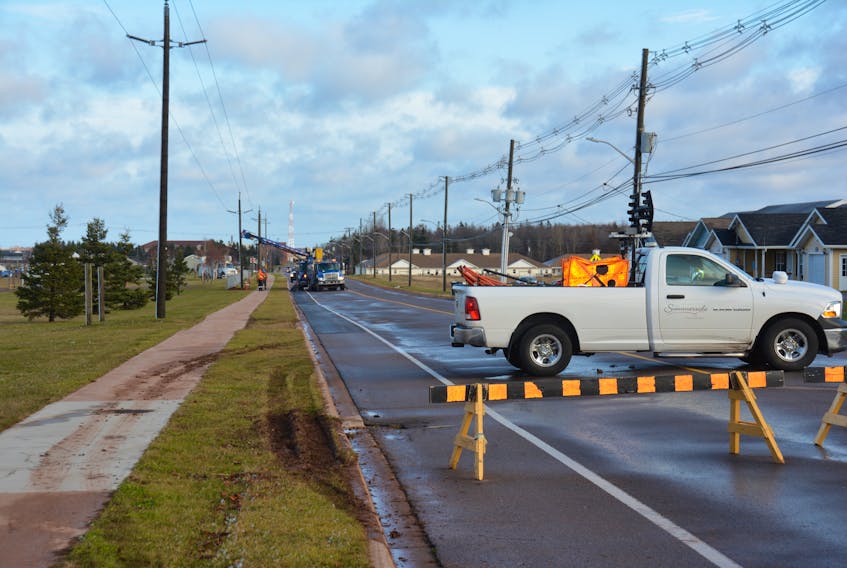 Crews work to repair a utility pole in Summerside, Thursday.