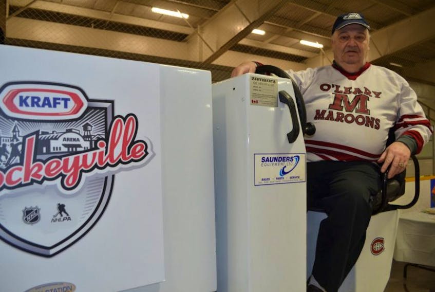 Allan McBain climbs onto the O'Leary Sports Centre's Zamboni for a final time. McBain retired as the arena's ice-maker Saturday, the same day that O'Leary won Kraft Hockeyville 2017.