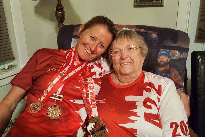 WO Charlene Arsenault is congratulated by her mother, Evelyn Arsenault of Tignish, after winning a Canadian Armed Forces national military marathon. WO Arsenault describes her mother as her biggest fan and supporter. WO Arsenault is a 31-year veteran of the Canadian Armed Forces.