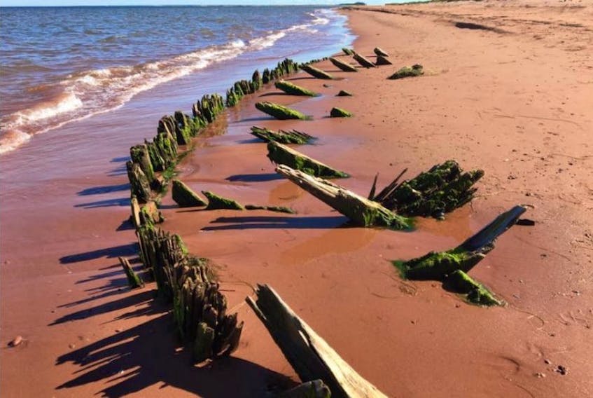 Photographs posted to social media have generated quite a debate over what low tide reveals on a beach near Jacques Cartier Provincial Park in Kildare. The most common theories are that it is the remains of either a shipwreck or a fisherman's long-abandoned private stage or wharf.