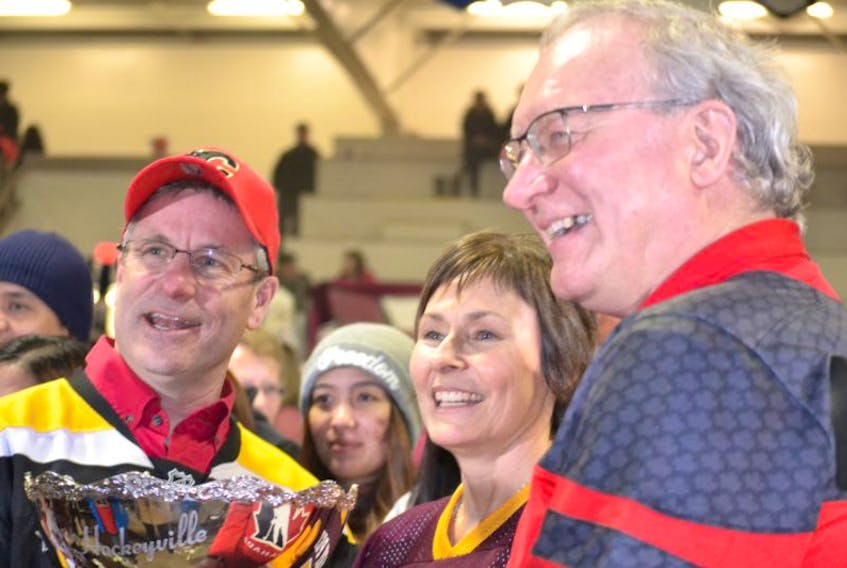 O’Leary Hockeyville committee member Della Sweet is congratulated by O’Leary-Inverness MLA Robert Henderson and P.E.I. premier Wade MacLauchlan after O’Leary was declared Kraft Hockeyville 2017 champion Saturday night.