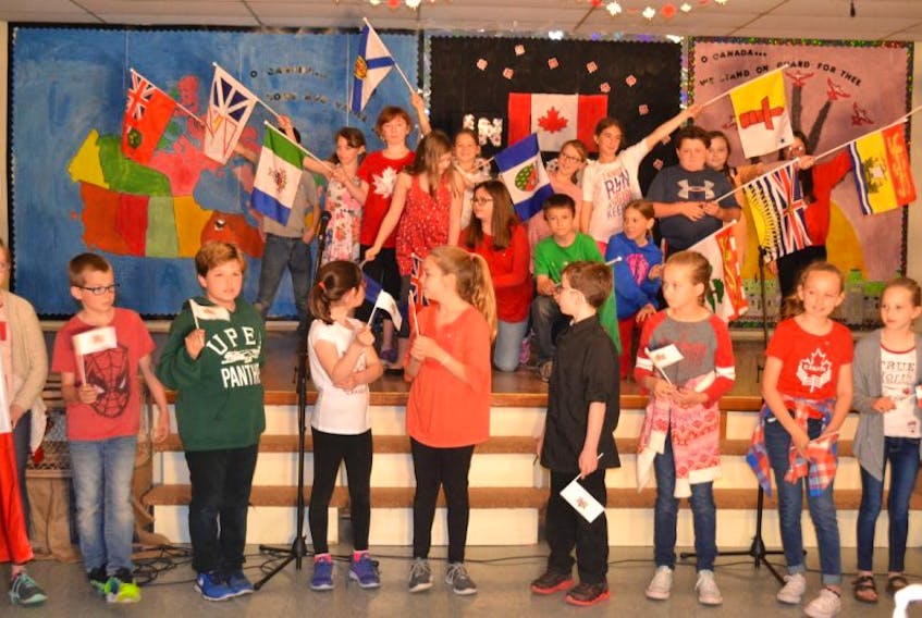 Ellerslie Elementary School students display the flags of the provinces and territories during the opening of their In Praise of a Nation concert. The concert  was a tribute to Canada’s 150th anniversary.