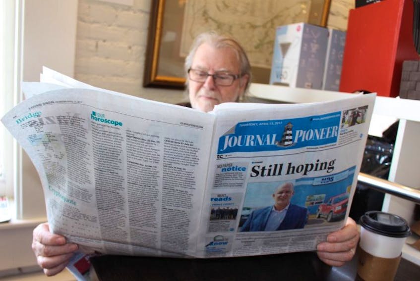 Graham MacKay reads a copy of the Journal Pioneer. The newspaper is one of 28 across Atlantic Canada that have been sold by Montreal-based Transcontinental Inc. to The Halifax Herald Ltd, owners of the Chronicle Herald.