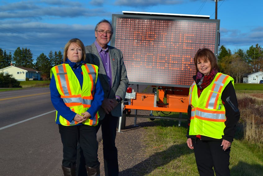 West Prince MADD Canada members, from left, Trudy Betts and Robert Goth, and Atlantic Canada Chapter Services manager for MADD Canada, Susan MacAskill is hoping the message that is being displayed on roadsides during its Red Ribbon campaign will be heeded by motorists