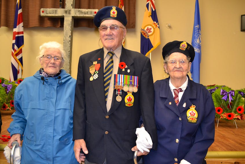 O’Leary Legion’s last remaining veteran of World War Two, Therin Ellis, poses with the senior members of the O’Leary Legion’s Ladies Auxiliary, Florence Turner, left, and Daisy Waite. Waite led the large Remembrance Day crowd in the singing of O’ Canada and God Save the Queen.