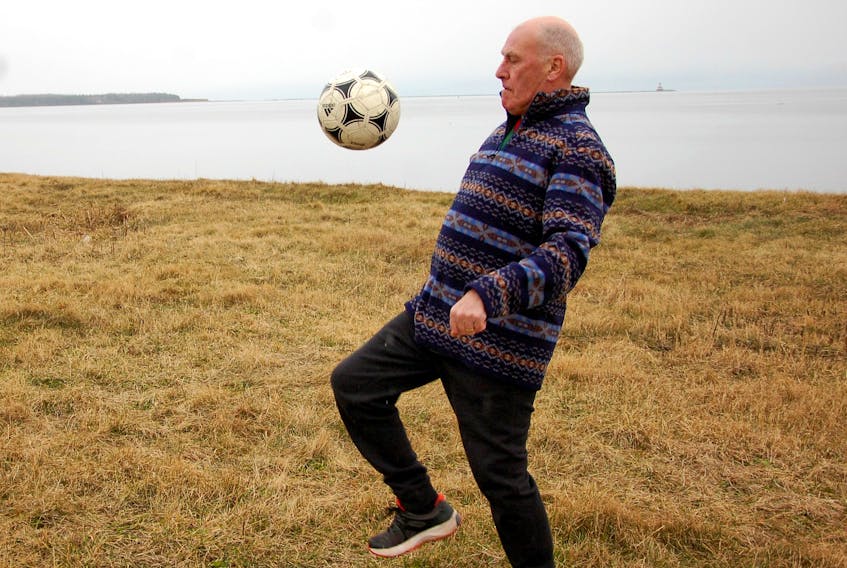 Dave McKay shows off his soccer skills using his feet, knees, head and chest to control the ball on a field in Summerside.