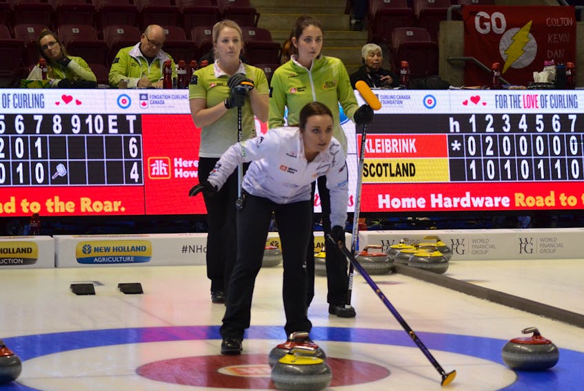Kelsey Rocque, Edmonton, directs her sweepers duering a Women’s Pool A game earlier this week against Winnipeg’s Shannon Birchard, right. With Birchard is her mate, Nicole Sigvaldason. The tie-breaking scenarios gave Rocque second place in pool A. Birchard is left in a four-way tie for third place and is in a tiebreaker game at 11:30 tonight against Shannon Kleibrink.