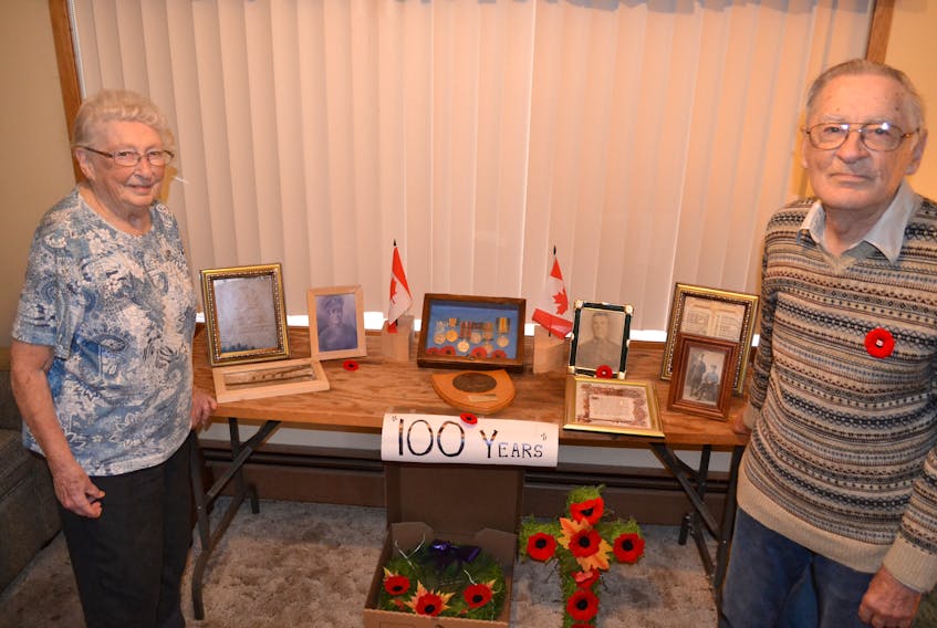 Frances and Alvah McAlduff show the 100th anniversary armistice display they set up in their home to honour their father, Frank, who returned from the First World War, and their uncle Jim, who didn’t make it back.