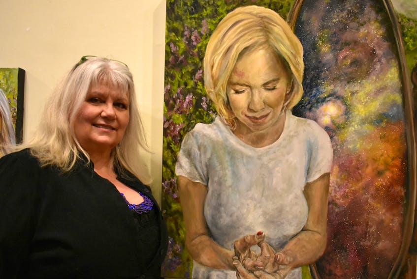 Bernadette Kernaghan stands beside her oil painting on ‘Patti.’