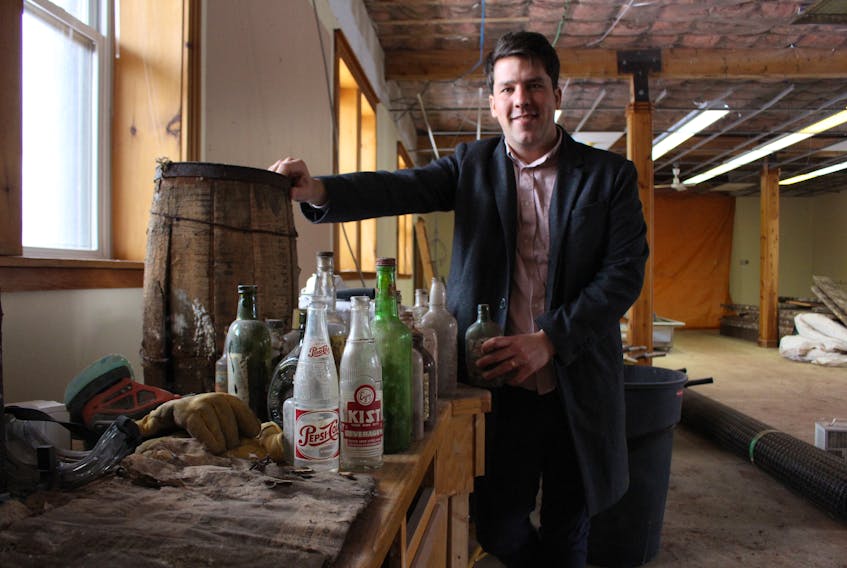 Alex Clark, co-owner of a soon to be microbrewery in Summerside, says countless old liquor and other drink bottles were found in the dirt floor of the former train station-turned library. Currently the building on Water Street in Summerside is being renovated into a microbrewery.