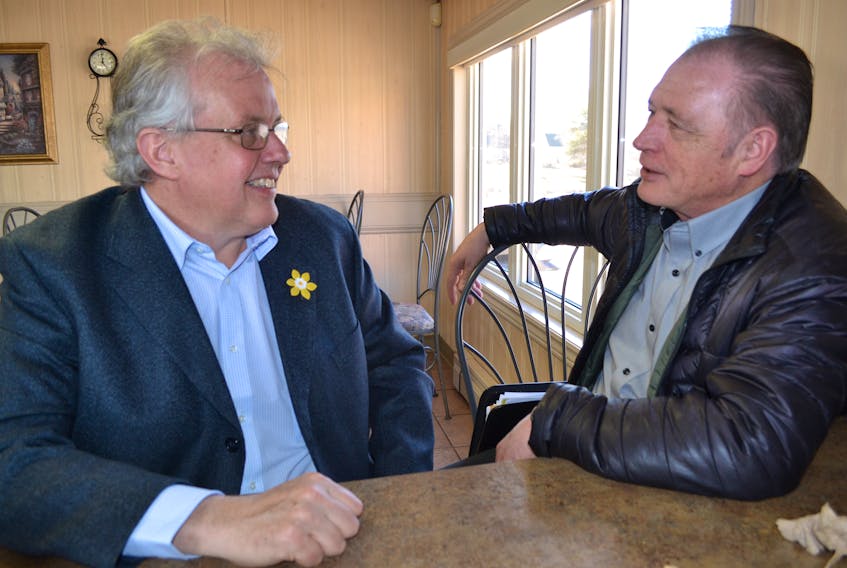 Island New Democrats leader Joe Byrne, left, chats with a former party leader, Dr. Herb Dickieson, during a western P.E.I. tour on Monday. Byrne was elected leader on April 7.