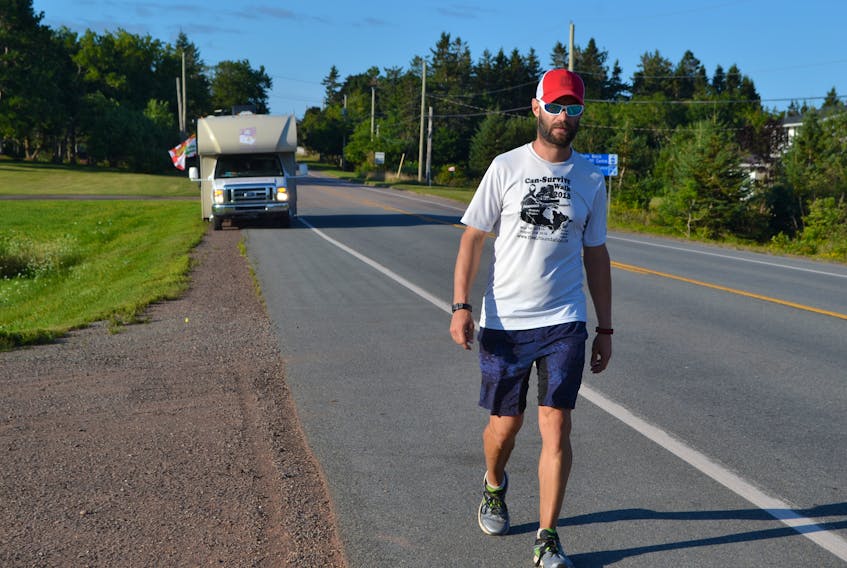 Can-Survive cross-Canada walker Jimmy Lefebvre continues to make good progress Wednesday morning as he walks along Highway Two, just west of Elmsdale Corner.