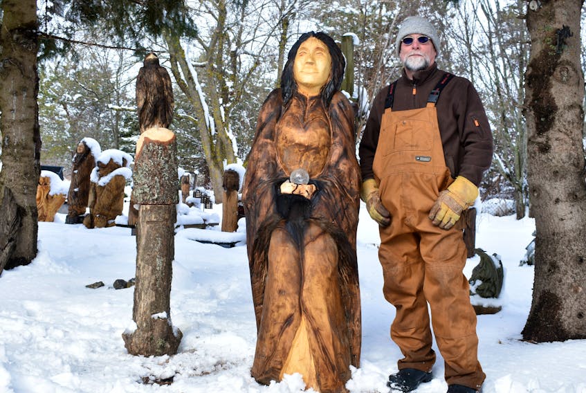 Summerside chainsaw carver Wayne Ellis reveals his newest wood creation Danu, the Celtic goddess of nature. Danu stands six-feet high in his backyard, while overlooking wild animals and mythical creatures that sprout from under a fresh blanket of snow.
