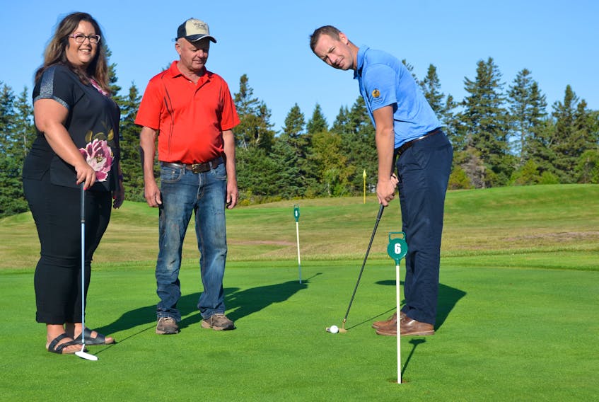 St. Felix Golf Club owner Paul Martin and West Prince Chamber of Commerce director Leah McGrath look on as Chamber president Geoffery Irving gives a putting clinic. The chamber’s second annual golf tournament, open to 18 teams of four, will be held at St. Felix Golf Course on October 5 with a 1 p.m. shotgun start.