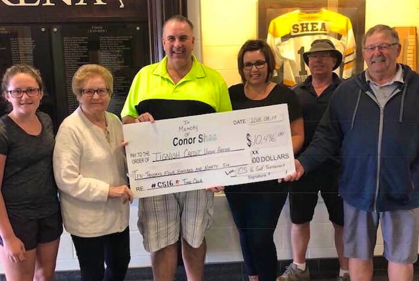Proceeds from the second annual Conor Shea Memorial golf tournament in Uxbridge, Mass., have been donated to Tignish Credit union Arena for the purchase of a new time clock Taking part in the presentation are, from left, family members of Conor Shea, his sister Madison, grandmother Anne, uncle Jimmy, and mother Tishie Shea; rink board member Murray Perry, and arena manager Harvey Myers.