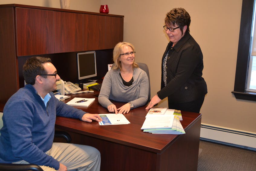 Finalizing plans for Rural Action Centre’s Neighbour to Neighbour Festivity are, from left, Sean Doyle, event coordinator; Maxine Rennie, the Rural Action Centre’s executive director and Barb MacDonald, Client Information Officer. The festivity will be held Feb. 10, 2 – 4 p.m., at Hernewood Intermediate School.