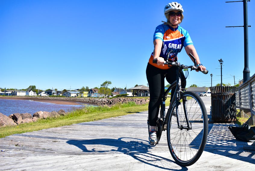 Catherine Coulson Gaudet cycles along the Summerside boardwalk in an effort to raise funds for kids’ with cancer because she believes “Kids should be living life, not fighting for it.”